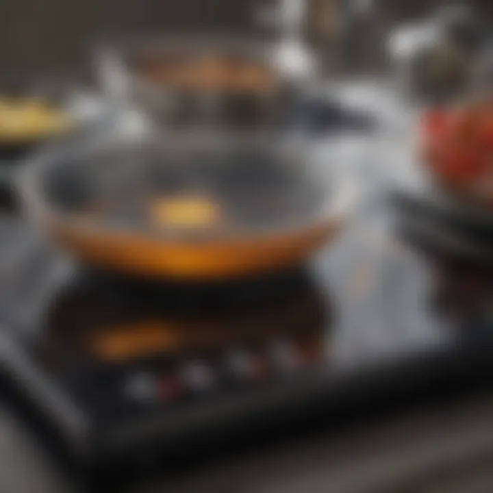 Close-up of an induction cooktop with illuminated controls