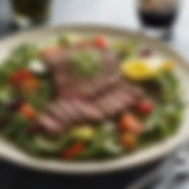 Gourmet steak salad topped with fresh vegetables and herbs