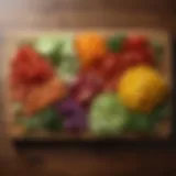 An array of colorful sliced vegetables arranged artistically on a wooden cutting board.